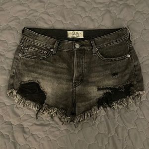 Free people low waisted black jean shorts, size 26.